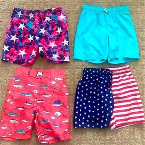 4 Pairs boys swim trunks. All 4T and all have liners inside.